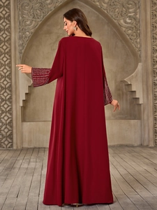 Detailed back view of a burgundy V-neck maxi dress with luxury rhinestone cuffs