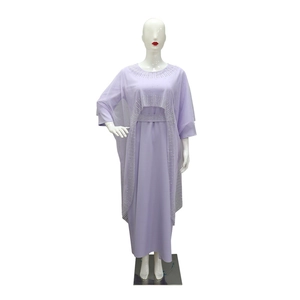 Detail of lavender maxi dress showing silver rhinestone trim on neckline and cape edge