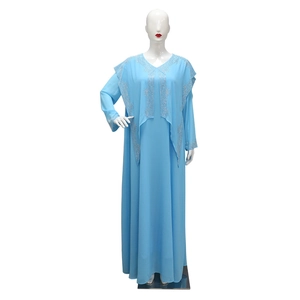 Detailed view of silver rhinestones and flower beadwork on light blue chiffon maxi dress