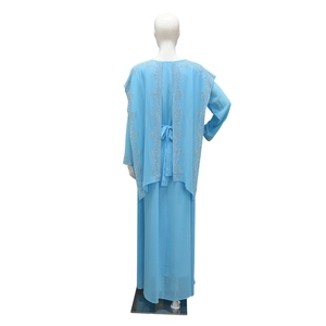 Detail of sky blue chiffon maxi dress with silver sequined embroidery and back tie design
