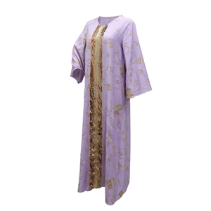 Detail of purple ethnic kaftan featuring golden sequin trim and floral embroidery