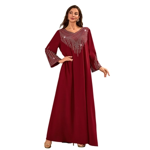 Detail of silver rhinestones on a burgundy V-neck long sleeve kaftan dress for women