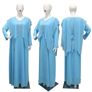 Detail of sky blue chiffon Abaya featuring silver sequin star patterns and beadwork