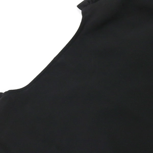 Macro detail of high-quality black evening gown fabric with precise stitching and texture
