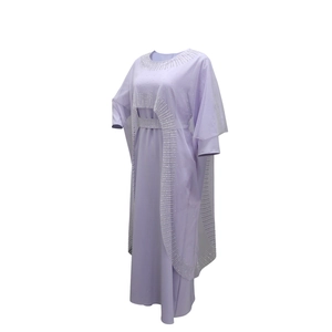 Detail of lavender Muslim abaya featuring intricate crystal beadwork on the collar and edge