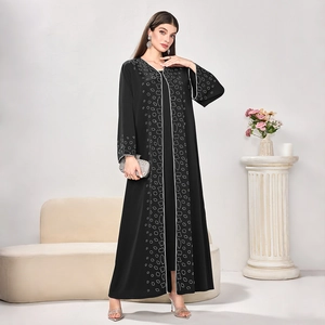 Detail of silver geometric embroidery on the front and cuffs of this black abaya robe