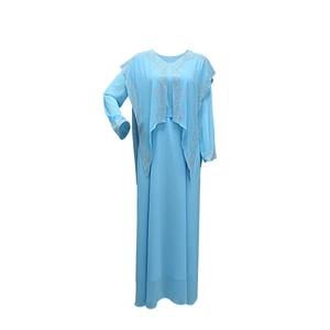 Detail of light blue chiffon abaya dress with silver rhinestone beadwork on collar