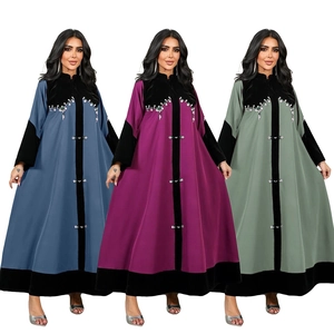 Detail of beaded velvet patchwork on Muslim abaya kaftan in blue, purple, and green