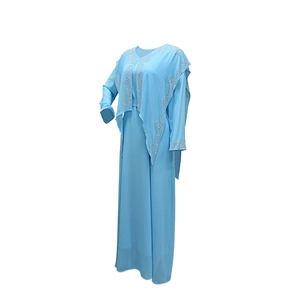 Detail of light blue chiffon dress with sparkling silver rhinestone floral patterns