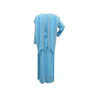 Detail of light blue Abaya dress featuring intricate silver sequins on a chiffon shawl