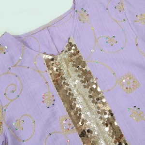 Close-up of ethnic embroidered robe showing purple fabric with gold sequins and beads