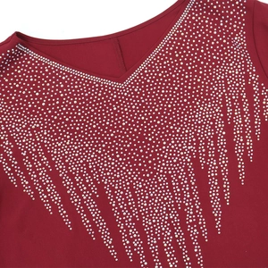 Detail of V-neckline on burgundy dress with glittering rhinestone fringe embellishments