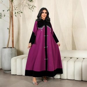 Close-up of velvet panels and silver rhinestone embroidery on this purple abaya dress