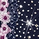 Detailed view of navy blue V-neck dress fabric with pink floral patterns and rhinestones