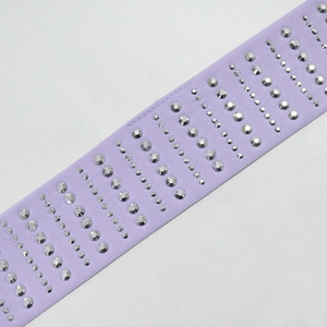 Close-up of lavender evening dress strap with diagonal clear rhinestone patterns