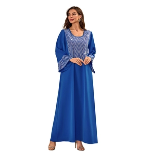 Detailed silver sequin geometric embroidery on cuffs of a royal blue Muslim kaftan dress