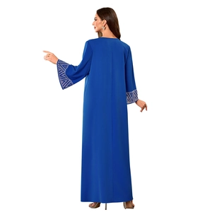 Rear view of royal blue Muslim abaya featuring silver geometric embroidery on cuffs