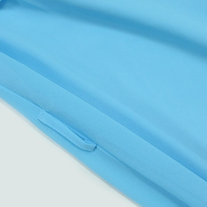 Detail view of the sky blue chiffon dress featuring neat stitching and a belt loop attachment