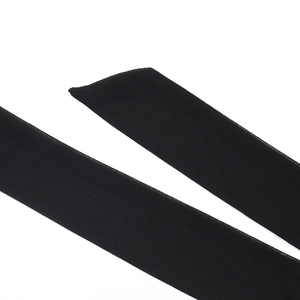 Detail of the elegant black rhinestone-belt with smooth texture and neat stitching