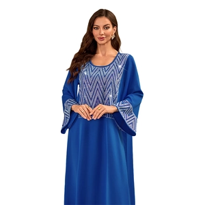 Detail of silver chevron rhinestone pattern on dark blue long-sleeved Muslim abaya dress