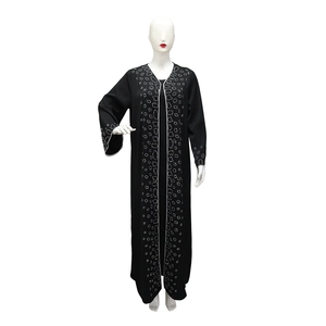 Detailed close-up of black Abaya featuring silver rhinestone patterns on the sleeves and front