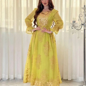 Elegant lemon yellow embroidered maxi dress with golden patterns and ruffled sleeves