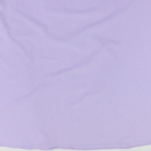 Macro detail of lavender woven fabric showing soft texture and fine stitching for evening gown