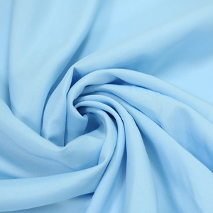Detail of light blue chiffon fabric showing its smooth texture and elegant soft drape