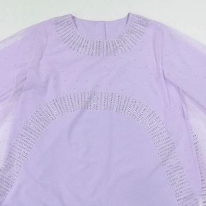 Close-up of lavender evening gown featuring silver rhinestone embellishments and sheer sleeves