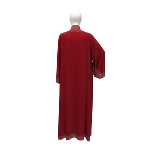 Detail of silver rhinestones on the sleeves and hem of this dark red kaftan dress