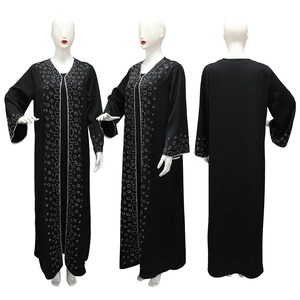 Detail of black Abaya with silver rhinestone patterns showing front, side and back views
