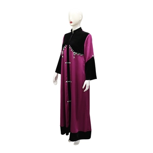 Close-up of velvet拼接and beaded embroidery on long purple satin robe garment