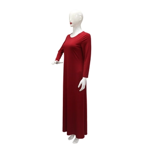 Detail view of red two-piece party maxi dress with long sleeves and elegant rhinestones