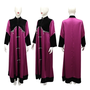 Detail of velvet patchwork abaya with contrast beading and green rhinestone patterns