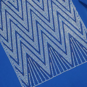 Close-up of hot-fix rhinestones in a V-shaped geometric wave pattern on navy fabric