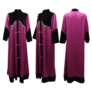 Detail of velvet patchwork robe with rhinestone embroidery and crystal button on purple satin