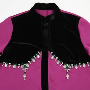 Detail of beaded velvet robe with rhinestone floral patterns and contrast stitching