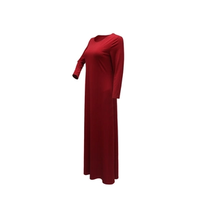 Detail view of the deep red long-sleeved evening gown with sparkling rhinestone accents