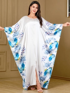 Elegant white satin batwing maxi dress with blue floral print and glossy finish