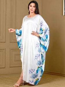 White satin kaftan maxi dress with blue floral print and elegant batwing sleeves