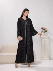 Elegant black long sleeve abaya with white beadwork and embroidery detailing