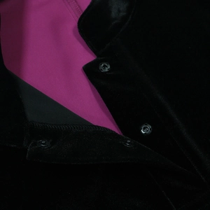 Detail of black velvet robe with hot pink lining and premium silver snap button closure