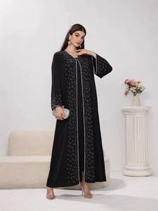 Elegant black Middle Eastern Abaya dress with silver sequin wavy patterns and long sleeves