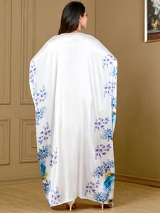 Elegant white silk-textured floral kaftan robe with long batwing sleeves and loose fit