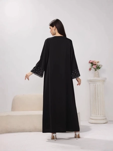 Elegant black long sleeve maxi dress with silver sequined cuffs for women
