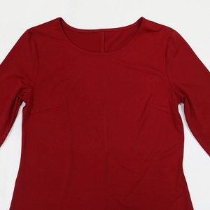 Detail view of wine red round neck robe featuring dart seams and premium smooth fabric