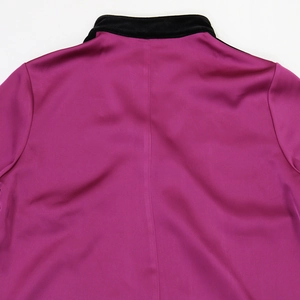 Detail of fuchsia satin robe with black velvet collar and vertical back stitching