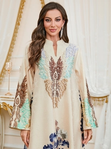 Detail of embroidered neckline and pearl accents on a Middle Eastern style kaftan dress