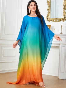 Detail view of vibrant gradient Kaftan dress featuring elegant batwing sleeves and loose fit