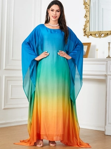 Detail of gradient silk kaftan dress showing smooth color transition and loose batwing sleeves